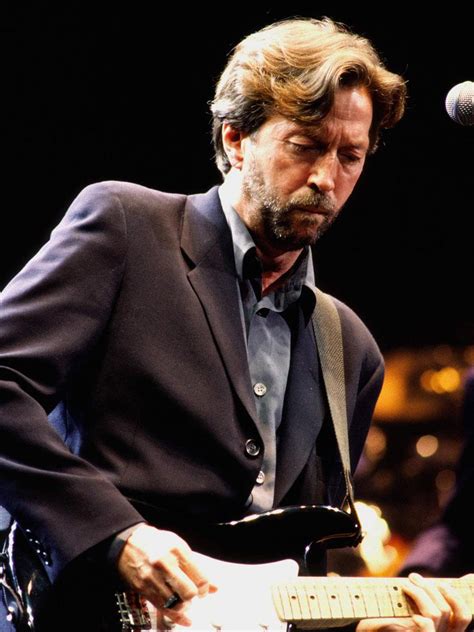 eric clapton pics in versace suit|Eric Clapton armani suit.